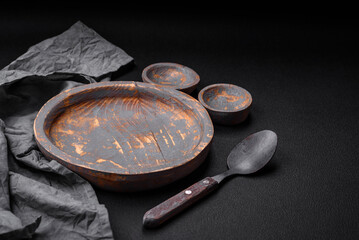 Empty wooden plate, knife, fork and cutting board