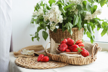 Happy mother's day, beautiful breakfast, lunch with strawberries on tray, bouquet of lilac. Festive concept. Spring holiday, family relations