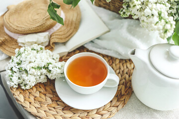 Cup of hot tea and spring home interior. good morning concept
