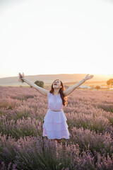 woman with bouquet in lavender nature walk journey at sunset