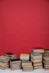 education science learning library stack of books on a red background