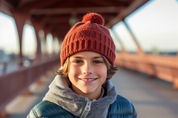Lifestyle portrait photography of a joyful boy in his 30s wearing a warm beanie or knit hat against a picturesque bridge background. With generative AI technology
