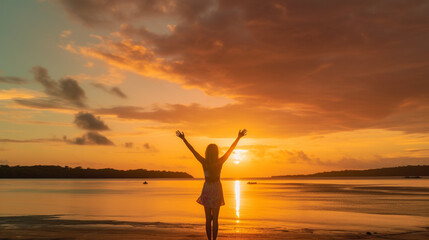 Happy woman silhouette in the sunset