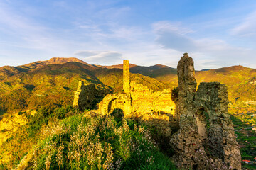 travel landscape of ancient castle on top of a hill or mountain with highland mountain landscape...