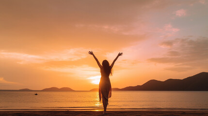 Happy woman silhouette in the sunset