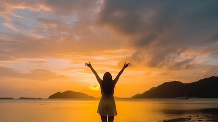 Fototapeta premium Happy woman silhouette in the sunset
