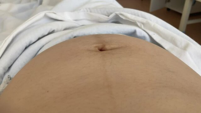 Cardiotocography. Pregnant Woman On Hospital Couch During Medical Control Cardiotocography.