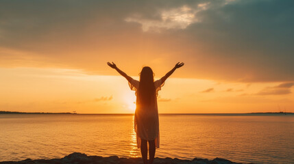 Fototapeta premium Happy woman silhouette in the sunset