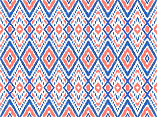 Red, Blue, and White Patriotic Ikat Geometric Seamless Pattern Background. The tribal-inspired ornament texture and intricate stitch lines create unique character.