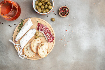 ciabatta and fuet. meat appetizer for wine. appetizers or antipasto set with gourmet food. place for text, top view