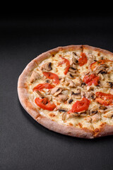 Delicious pizza with chicken, tomatoes and cheese with salt and sauce