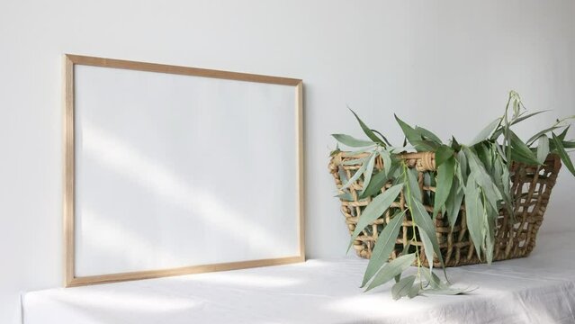 Video wooden photo frame mockup with beige vase with eucalyptus 