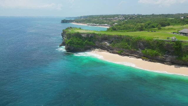 Balangan Beach is one of Bali's most scenic spots, featuring a gorgeous half-kilometer stretch of golden sand between vegetated limestone cliffs. 