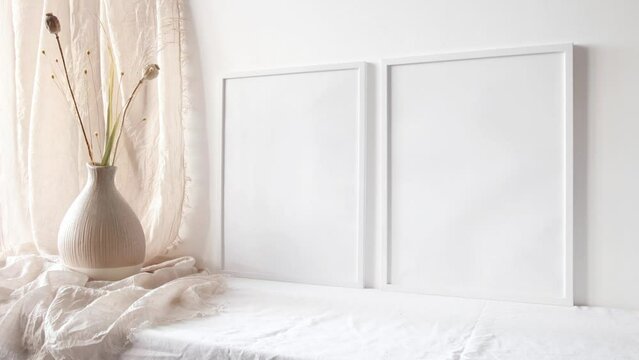 Video two white photo frames mockup with dry flowers