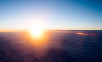 Beautiful sunset sky above clouds