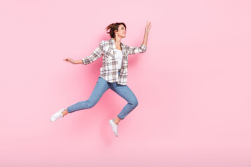 Fototapeta na wymiar Full size body cadre of bob brown hair lady running lightness freedom vacation after hard business days isolated on pink color background