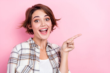 Closeup photo of astonished marketer woman direct finger creative design company buy shutterstock cadres isolated on pink color background