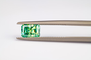 Radiant cut green gemstone