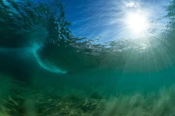 Fototapeta na wymiar underwater wave breaking on a beach in australia