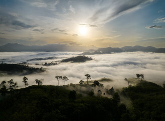 Beautiful morning Sunrise and sea of fog flow over  Khao Jang Lone mountain, Nakhon si Thammarat,  Thailand - obrazy, fototapety, plakaty