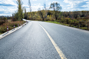 Empty asphalt road and colorful autumn scene