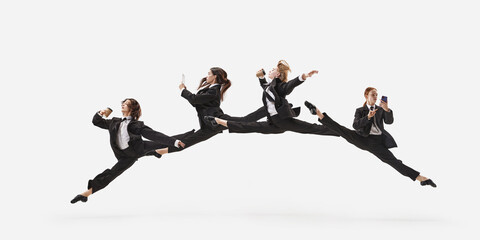 Portrait with group of beautiful women, ballet dancer in classical suit jumping in twine over white color studio background. Concept of business, office lifestyle, success - obrazy, fototapety, plakaty