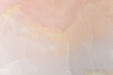 Light pink blurred background made of pink jade or Nephrite