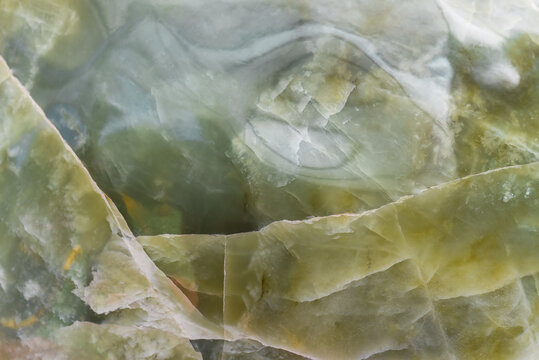 Light green blurred background made of green jade or Nephrite