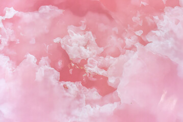 Light pink blurred background made of pink jade or Nephrite © Tatiana