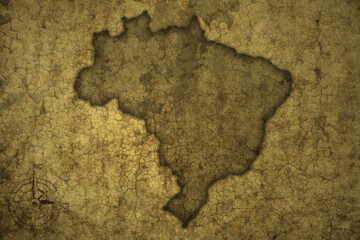 map of brazil on a old vintage crack paper background .