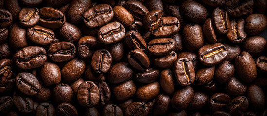 Obraz premium Panoramic horizontal background of roasted coffee beans. Generative AI illustration.