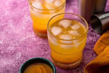 Summer cocktail with mango juice and ice