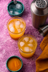 Summer cocktail with mango juice and ice