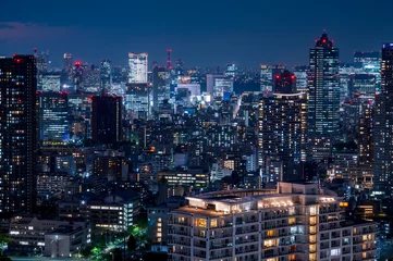 Fotobehang Nightlight Cityscape of Tokyo, city aerial skyscraper view of office building and downtown and street of minato in tokyo with twilight sky background. Japan, Asia © lukyeee_nuttawut