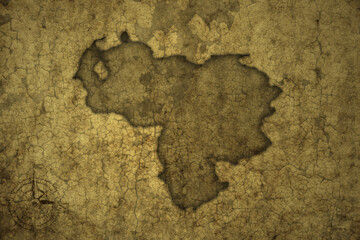 map of venezuela on a old vintage crack paper background .