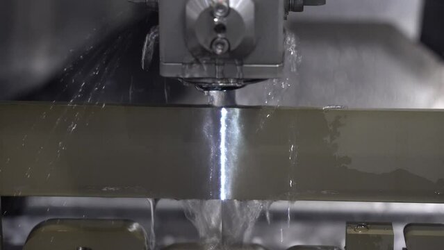 Closeup scene the wire EDM machine cutting the mold insert parts.