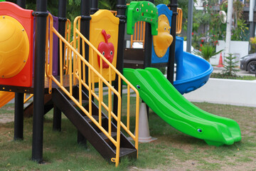 In a playground with colorful toys suitable for children for good development.