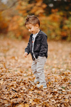 Child in the forest smiling and playing