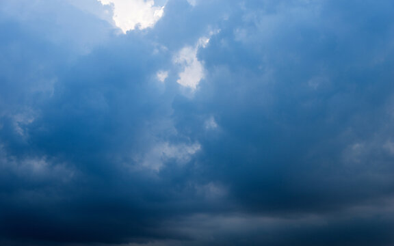 Dark blue cloudy sky for background