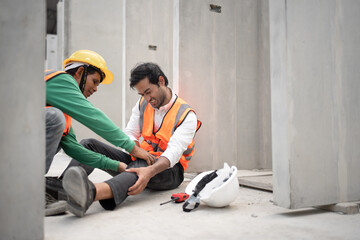 Technician Asia engineer man worker leg accident and friend helping in precast site work