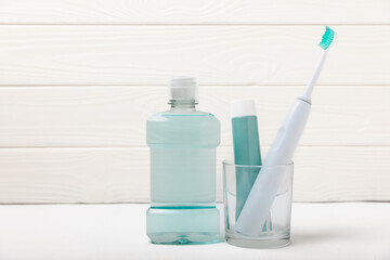 Bathroom with sonic electric toothbrush, toothpaste, mouthwash, dental floss and tongue cleaner . Oral hygiene. Dental care.Dentistry concept.Place for text.Place for copy.MOCKUP