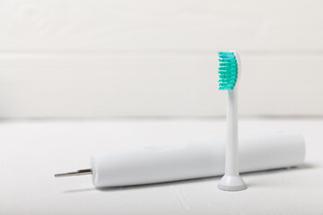 electric toothbrush on marble background with copy space. Flat lay. Oral hygiene. Oral Care Kit. Dentist concept. Place for text. Place to copy.