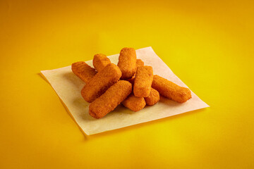 Fried chicken nuggets on a yellow background