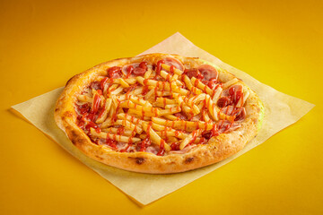 Fresh classic pizza with tomato sauce, mozzarella, spicy chorizo, bell pepper on a yellow background