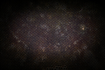 Dark hexagon background and texture of dry deserted honeycomb.