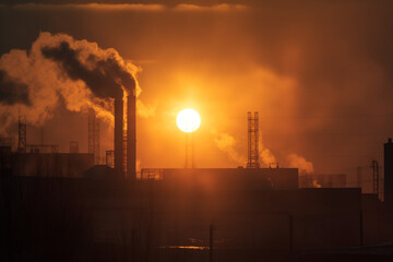 silhouettes of Chimneys from industrial plants make emissions and pollute the air at sunset. Generative AI	