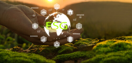 World environment day concept. Hand holding crystal globe with circular economy icon Zero net greenhouse gas emissions Sustainable development. solar power and green business, renewable energy, ESG