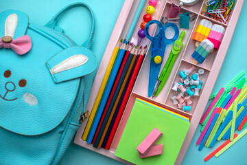Stylish colored stationery and school supplies in the organizer. Creative organization of stationery storage. The concept of returning to school.