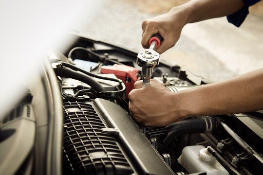 Mechanic open vehicle hood checking up auto mobile, fixing a car at home,Repair and service