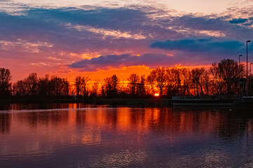 Sunset with reflections near Plattling, Isar, Bavaria, Germany